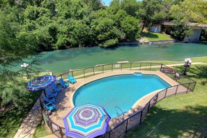 Swimming pool overlooking the Comal River!