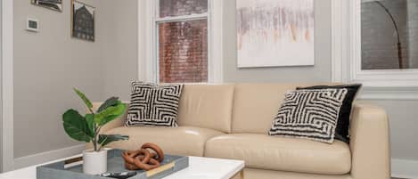 Apt 1 – Unwind on the comfortable living room couch to enjoy a movie