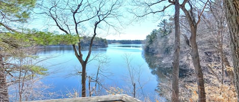 The home overlooks Lake Cochituate in a private setting surrounded by woods!!