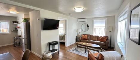 Living room, dining and kitchen. Leather sofa with a pull out bed.