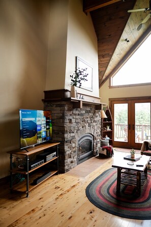 Living area with Roku TV and gas fireplace