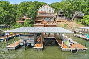 Dock with swim platform, SUPs, kayaks and available boat slip for your use.