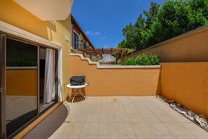 Bright and spacious outdoor space with BBQ area.