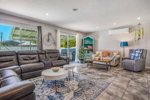 Oversized family room overlooking the patio and pool. 