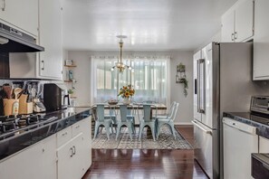 Oversized dining table seats up to 10. 