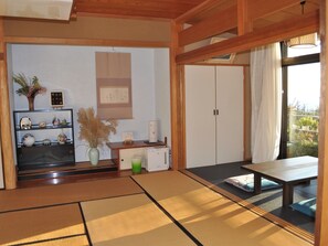 A bright 14 tatami mat Japanese-style room with an alcove