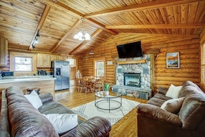 Living room with smart TV, cable and electric fireplace.
