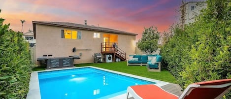 Private pool and hot tub with outdoor living space and fenced yard