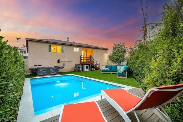 Private pool and hot tub with outdoor living space and fenced yard