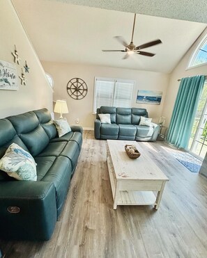 This is where you can sink into the cozy reclining couches ...