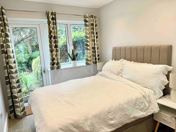 Bedroom with mature garden view