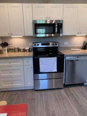 Kitchen with full size appliances and Bosch dishwasher.  Microwave above stove