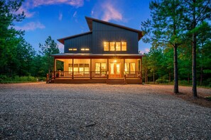 Stunning front covered patio! Who is ready for morning coffee!?