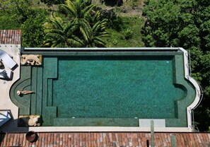 With an immense and creatively constructed pool in a private privileged location