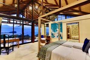 Floor-to-ceiling glass doors offer privileged ocean views of Manuel Antonio.