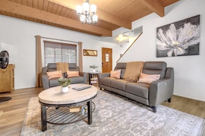 Cozy up in the inviting living room with warm, earthy tones.