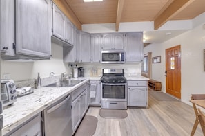 Prepare delicious meals effortlessly in the well-appointed kitchen.