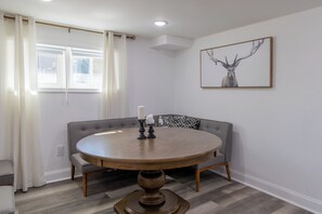 Dining area with bench seat to allow for group meals. Doubles as a workspace