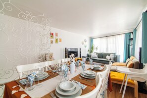 An 8-person dining table, a high chair