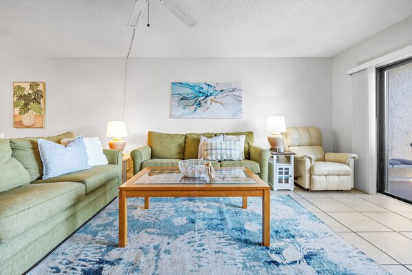 Relax in the cozy living room with stylish furnishings and a welcoming ambiance.