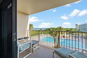 Relax on your private balcony, perched above the pool and beach, and soak in breathtaking coastal views.