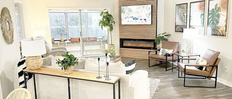 Beautiful living rm: SMART TV, electric fireplace, coffee bar, sunrm, dining rm