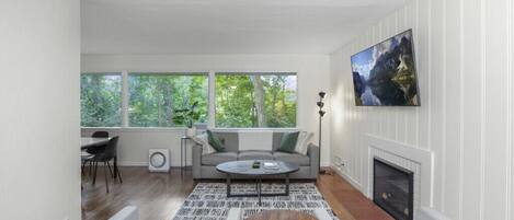 Sunny Living Room Overlooks Private Backyard