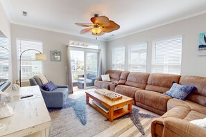 Plenty of natural light in this living area with a large sectional for relaxing