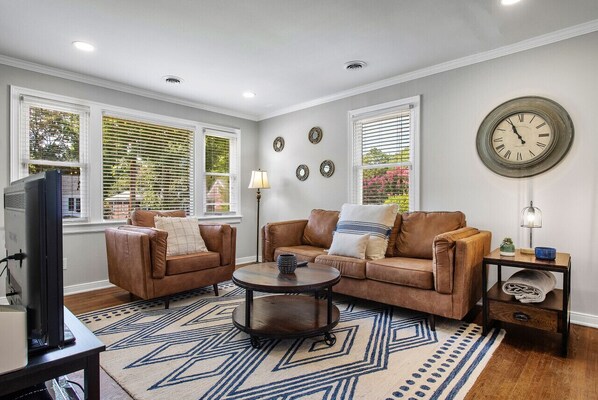 Spacious, modern living area with TV and amazing natural light!