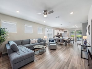 Gorgeous Downstairs Living Area with Comfortable Seating and Flat Screen TV