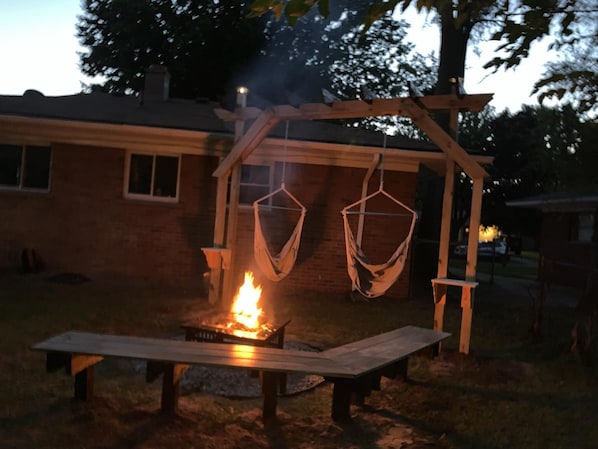 swings down for the winter. firepit can still be used 