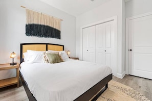 Queen-size bed with large closet.