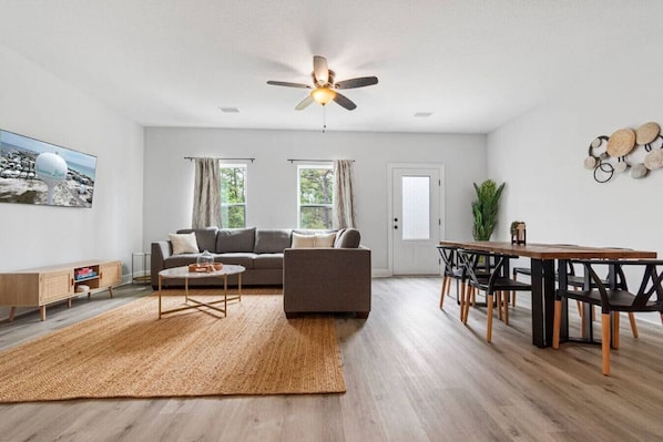 Spacious living and dining area with natural materials for a calming and relaxing atmosphere.