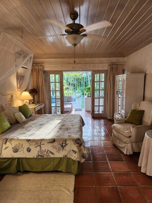 Master bedroom with ensuite, leading to patio and pool.