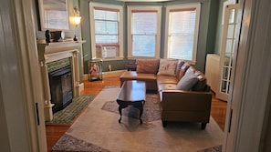 Second of the two living rooms. Has fireplace and leads into a smaller sun room.