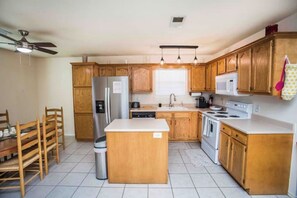 Full kitchen for family meal preps. Silverware for adults and children.