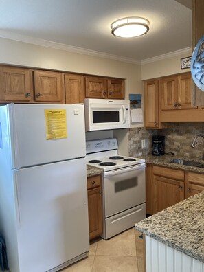 Kitchen has microwave, full size fridge, stove/oven, dishwasher.