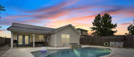 Main house sunset view with the pool