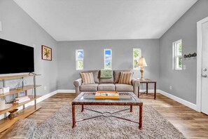 Open Living Room with a Queen Sleeper Sofa in the Guest House