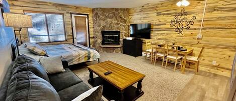 Cozy cabin decor. 55" smart tv, King Sized bed and queen sized pull out couch.