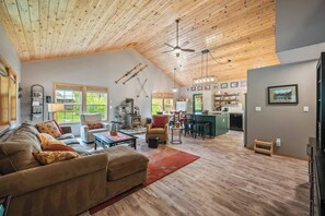 Open concept at its best: living, dining and kitchen in one space with beautiful vaulted ceiling and gas fireplace.  