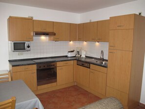 Brown, Countertop, Cabinetry, Property, Kitchen Stove, Kitchen Appliance, Kitchen, Sink, Home Appliance, Wood
