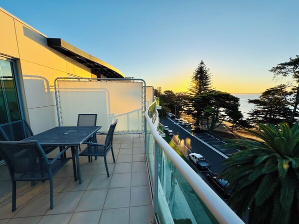 Balcony sunset view overlooking beach and park