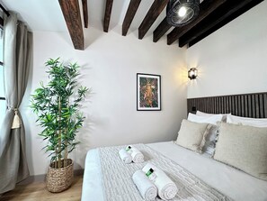 Bedroom full of light with fan
