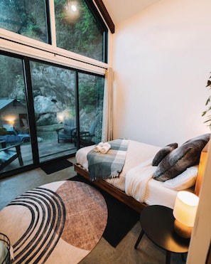 The main floor bedroom has a queen-size bed and also comes with a pillow menu.
