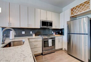 Enjoy cooking again in our designer kitchen with all new stainless appliances!