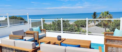 Panorama ocean & beach views from private rooftop deck.