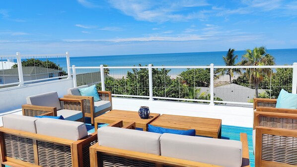 Panorama ocean & beach views from private rooftop deck.