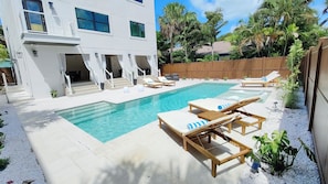 Private heated lap pool. Pool deck with 6+ lounge chairs on artistic shellstone 