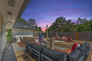 Outdoor oasis: relax by the fire pit or enjoy al fresco dining under the lights.